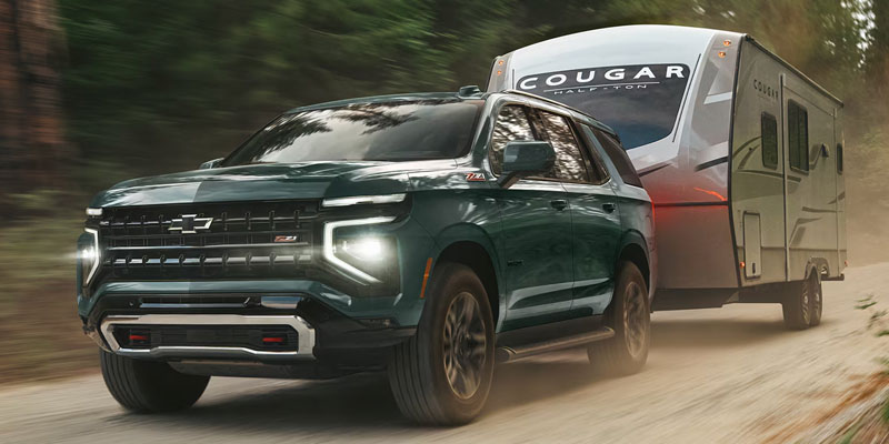 2026 Chevy Tahoe towing a camp trailer