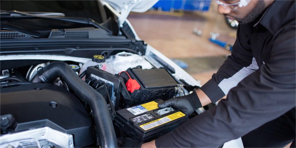 Technician at Kirk Brothers Chevrolet of Vicksburg testing a Chevrolet battery during a service inspection