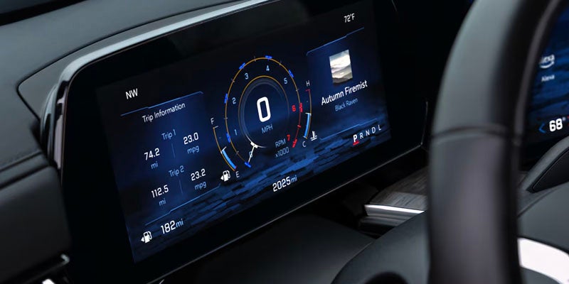 A digital dashboard and instrument cluster display inside the car